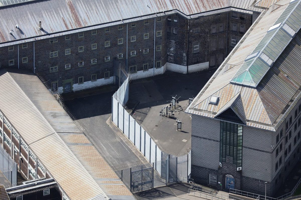 Aerial view of a prison wing and exercise yard