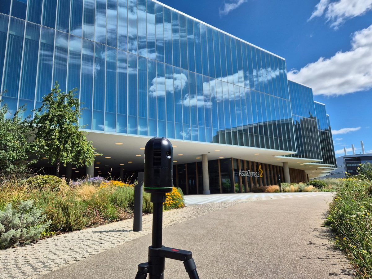 Laser scanner set up outside a glazed science and research building